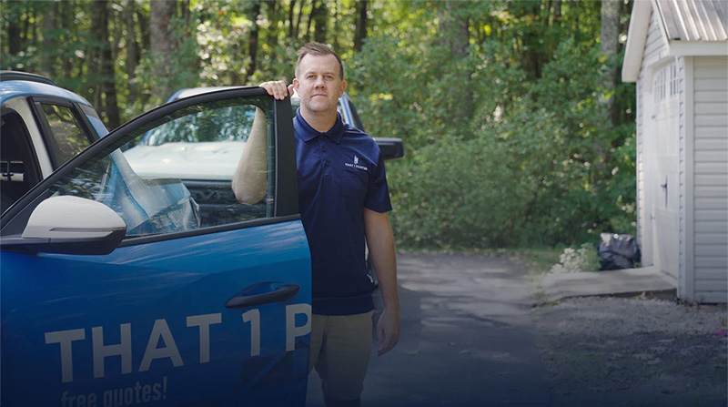 That 1 Painter franchise owner standing by branded truck